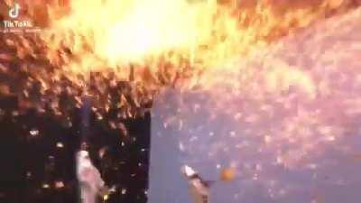 Smacking molten iron with a shovel