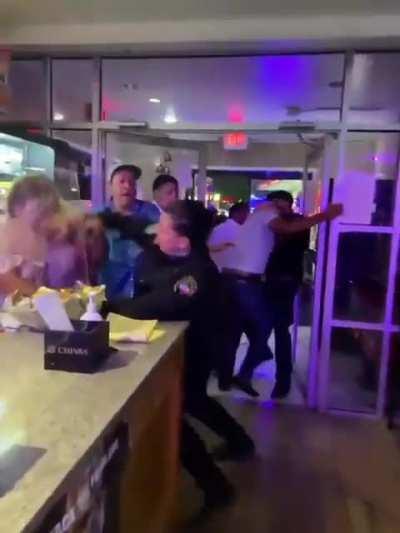 Lady cop throwing hands with a vengeance