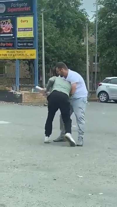 Guy gets hit on the head with a piece of concrete slab