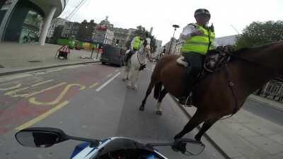 Biker doing a wheelie gets told off by mounted CoLP officer [UK]
