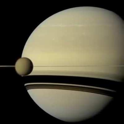 Timelapse of Europa and Io orbiting Jupiter captured by the Cassini probe