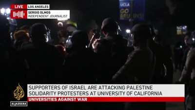 UCLA: Pro-Palestinian protesters attacked by Israel supporters using sticks, bottles and fireworks | Al Jazeera