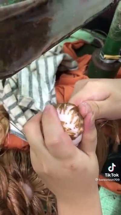 Specialist sewing machine to embroider a doll’s head with hair
