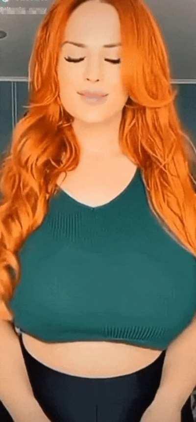 redhead in green