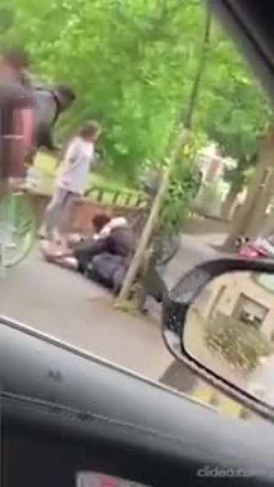 UK Police Officer attacked while on the ground - bystander poses for selfie