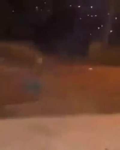 Kid uses handheld firework like a magic wand