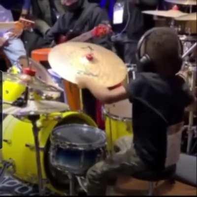 Kid playing drums