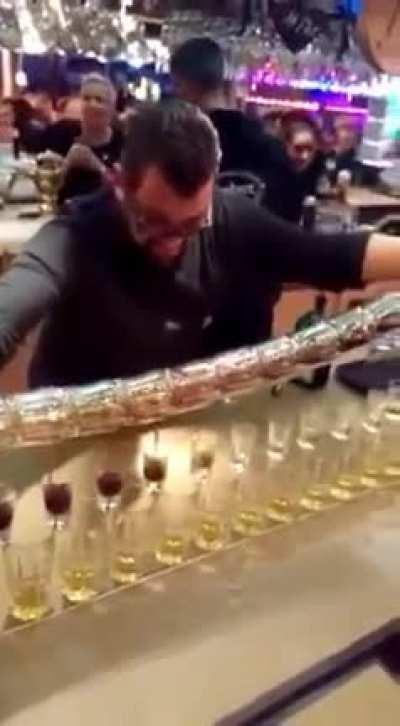 Watch a master pour jaeger shots from a tower of glasses