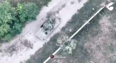 ua pov - Russian soldier falls out of a BMP and runs after it as a Ukrainian drone watches