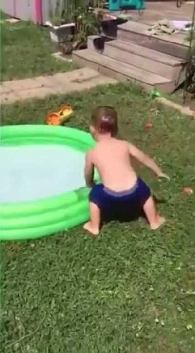 child trying to get into a pool