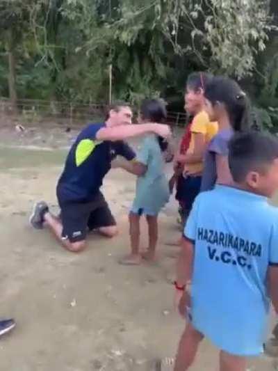 Young athletes when they meet their hero! Brazilian volleyball star Giba interacting with kids in a village in Assam.