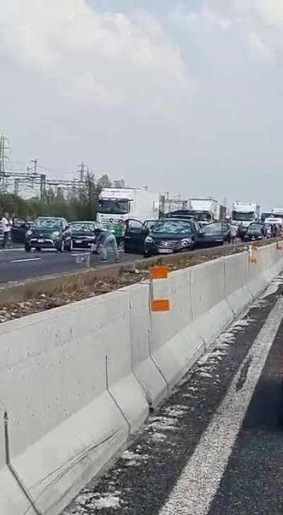 People are forced to stop on an highway in Italy, due to a sudden hailstorm that destroyed the windshields of their cars. 26 July 2021