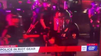 Louisville, Kentucky cops lighting up a news crew with rubber bullets