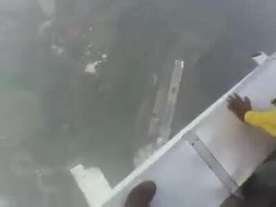 Walking on top of a tall building