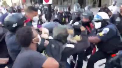 Protesters hand rioter over to police