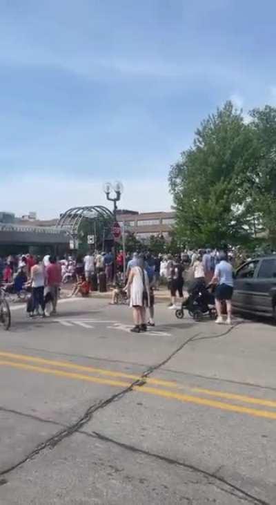 Video captures the sound of gunshots during a mass shooting at a July 4th parade today in Illinois. At least 5 are dead and 16 are injured. Gunman is at large.