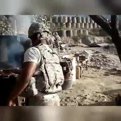 Having a Barbeque in Korengal, Afghanistan while being shot at by taliban