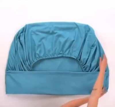 Easily, and neatly, fold a fitted bedsheet