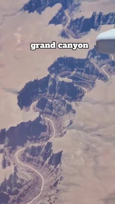 Aerial view of Grand Canyon in Arizona, showing the Colorado River's erosion over millions of years.