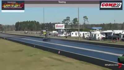 Camaro goes airborne in a drag race, proceeds to stick the landing and keep going