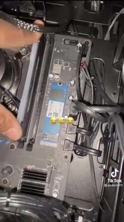 Let’s install PC parts with one hand and record for TikTok with another. What could possibly go wrong?
