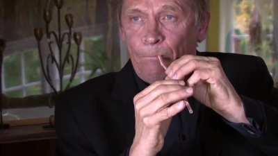 Peter Bastian playing a straw like a double reed instrument