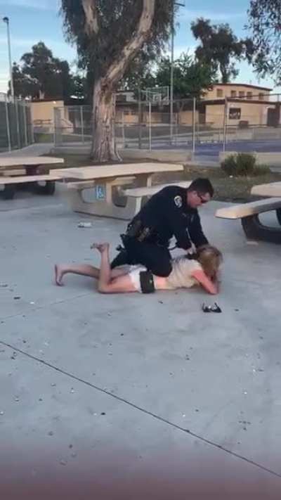 Police officer slams woman on the concrete and then cuffs her