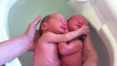 Very recently born twins who think they're still in the womb....