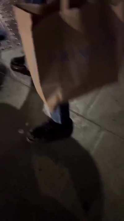 Bystanders help put out a fire on a man burning in the UK