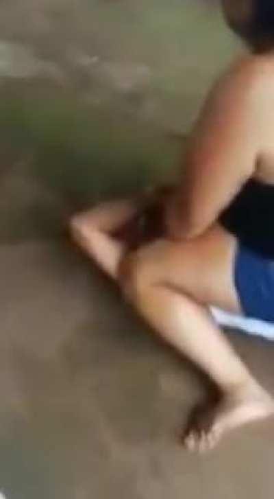 Girl Dominates a Guy in a street fight . Sit on him