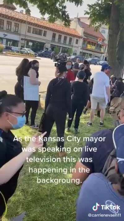 “There’s a police officer with their knee on someone’s back right now!”