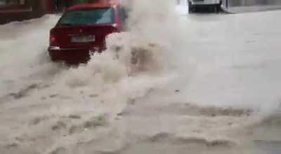 WCGW trying to drive through a flooded street 