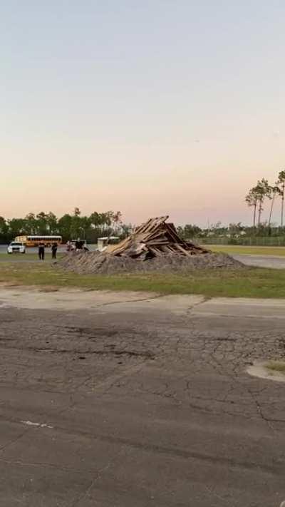 To light a bonfire at a high school event