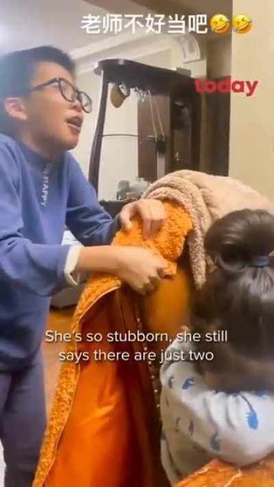 Chinese boy cries in frustration while teaching his sister maths