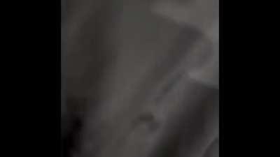 Man trips under car doing donuts