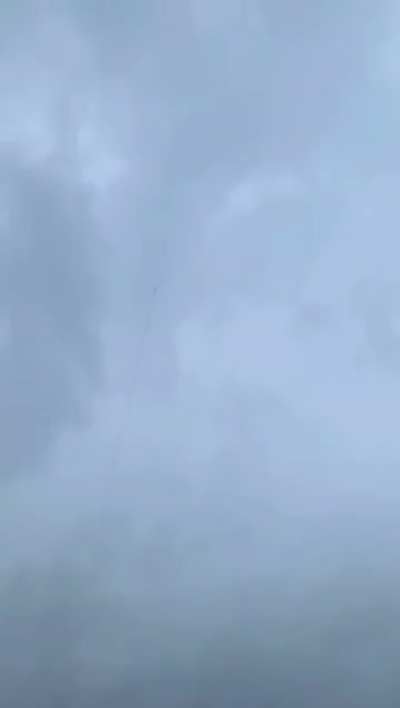 Lighting bolt guided to the ground by rocket trail