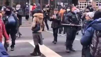 In Germany, police are walking around with 6’ sticks to stop the spread of COVID outdoors 🤡🍿🍦🎪🎈