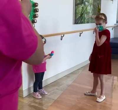 6 - year old girl rings the bell after nearly two years of intense treatment.