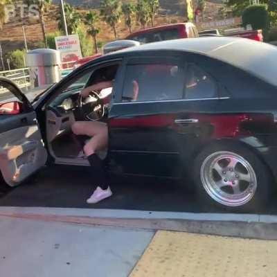 Woman hits a man's car repeatedly and drives over the curb to get away