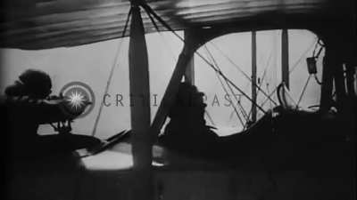 Possibly oldest surviving footage of a dogfight. Rumpler C.IV observer firing on an unknown pusher type biplane, mid-late WW1