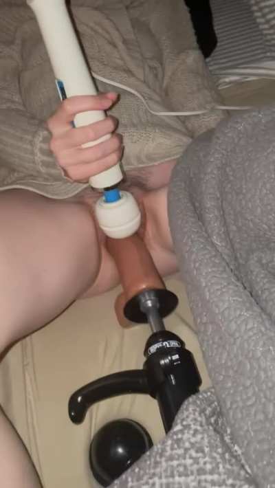  a milf playing with her pussy under the blanket. 