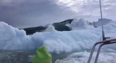 Boat flees from a falling glacier that causes a huge wave