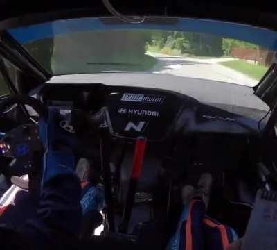 Rally car almost has head on collision at speed