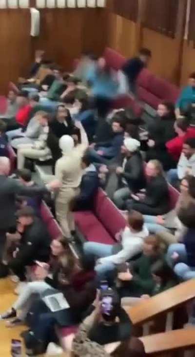 A student at UC Dublin needs to be calmed down after shouting “We will do what happened on October 7th Again and Again. Allahu Akbar.”