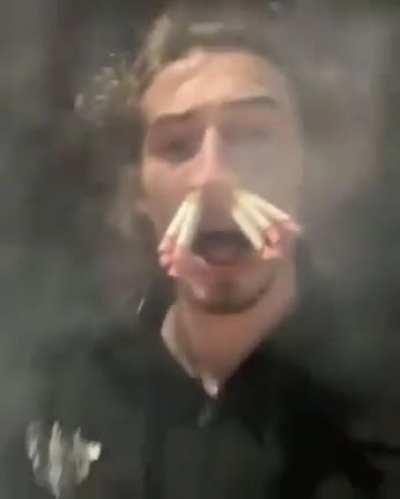 Idiot smokes 8 cigarettes in his nose