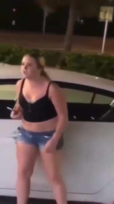 Trying to start fight in gas station parking lot... halter top ✔️ barefoot ✔️ saying the N word ✔️