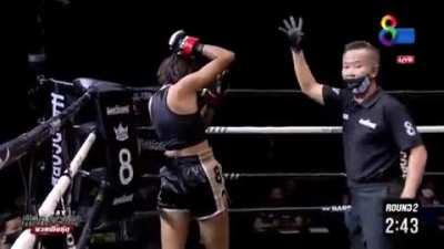 Muay Thai fighter uses 8 count to pop her arm back into the socket . . . and is good to go!