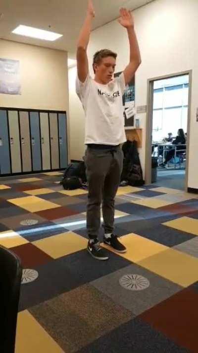 Trying a backflip in school