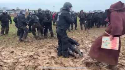 German riot police defeated and humiliated by a mud wizard.