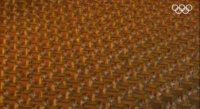 The sound of 2008 people drumming to the same beat.